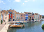 The old harbor of Martigues with traditional wooden boat. Martig